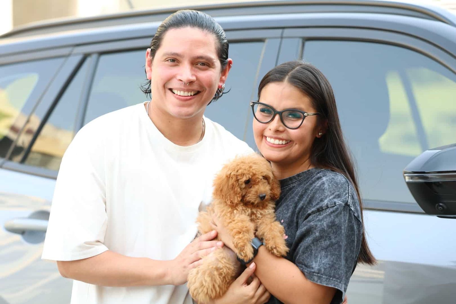 Family with new puppy from Puppies Hub